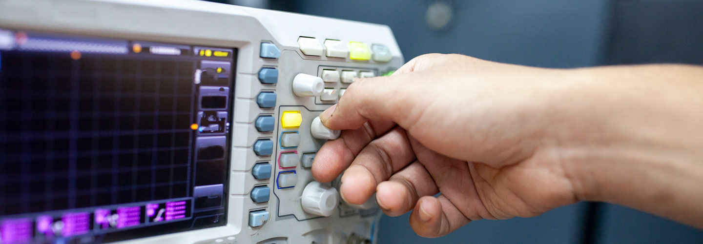 user operating an oscilloscope