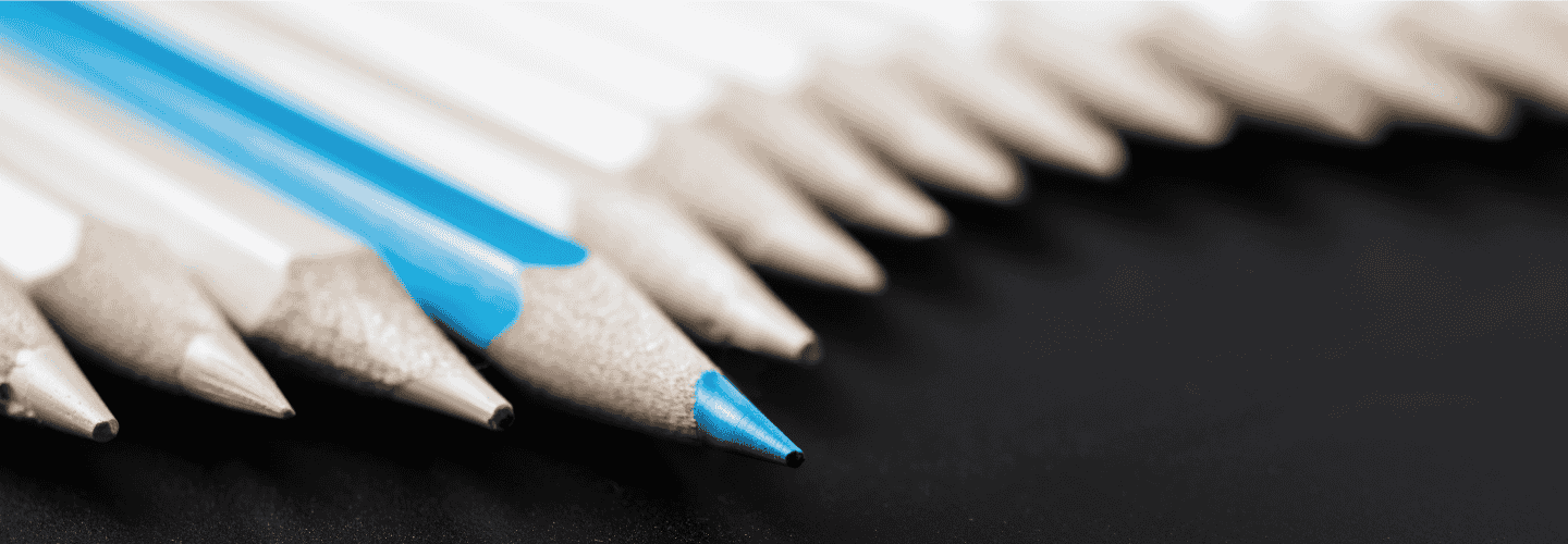 blue pencil in a line of white pencils, indicating standout content